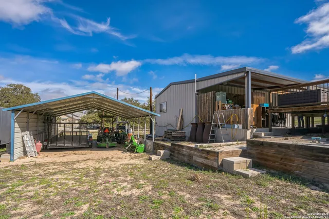 a view of a backyard with a patio
