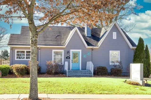a view of a yard in front view of a house