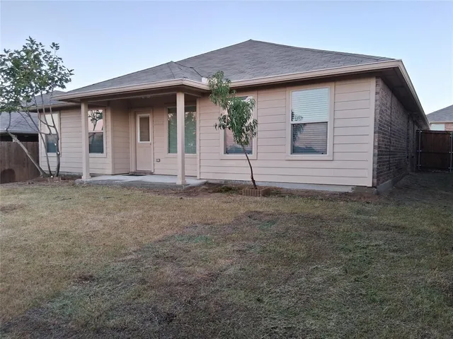 a house view with a backyard space