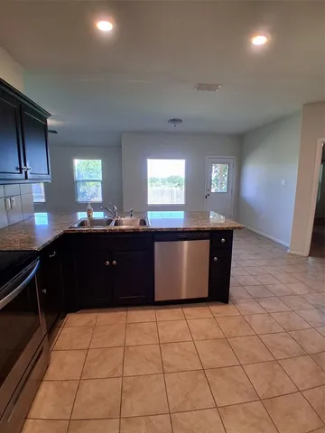 a room with a cabinets and window