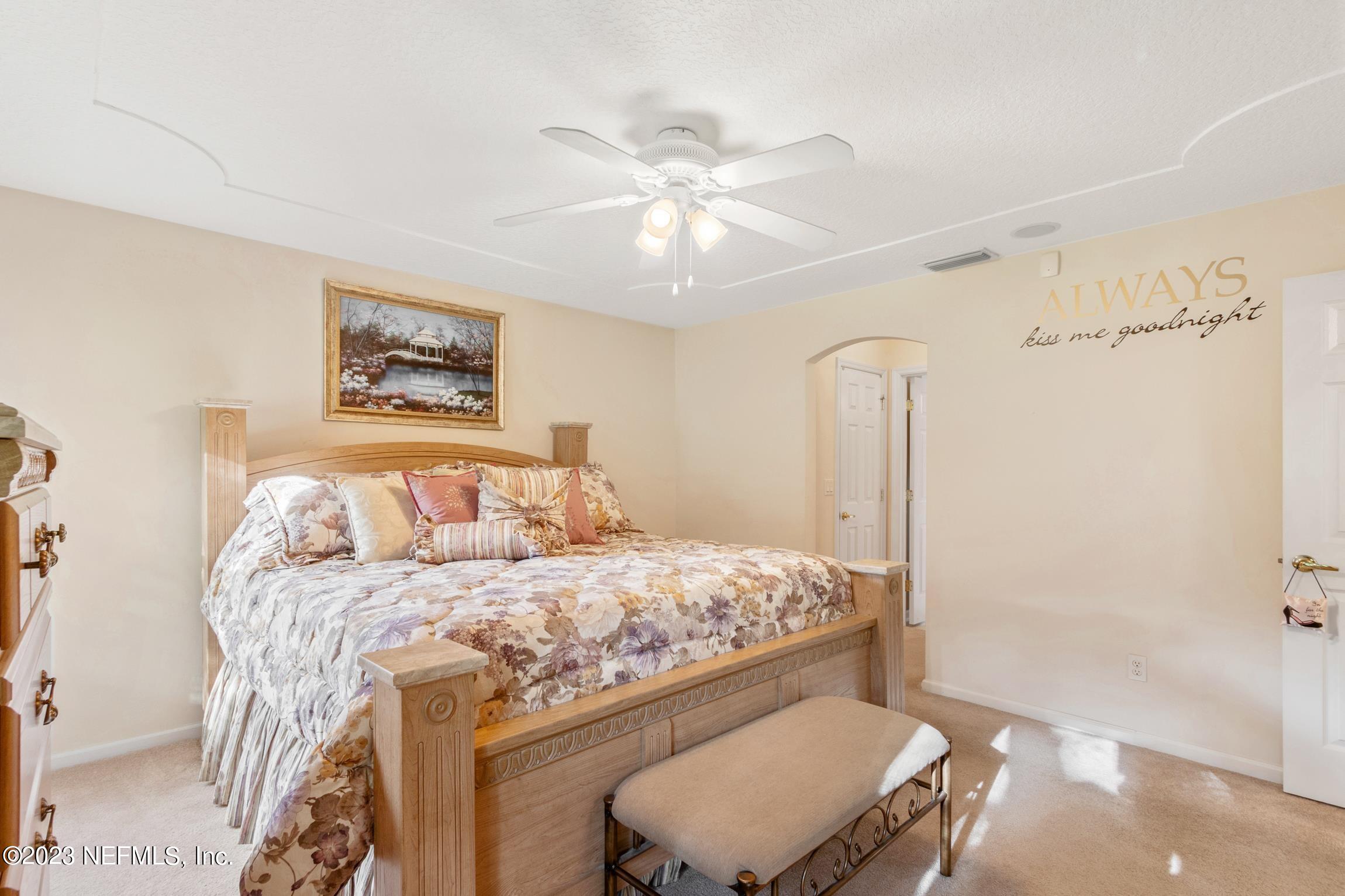 1796 Keswick Road St. Augustine, FL 32084 - Photo 16 of 48 a bedroom with a bed and a painting on the wall