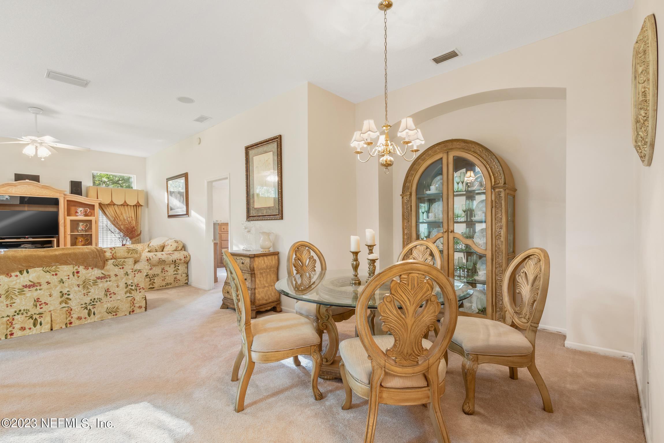 1796 Keswick Road St. Augustine, FL 32084 - Photo 3 of 48 a dining room with furniture and chandelier