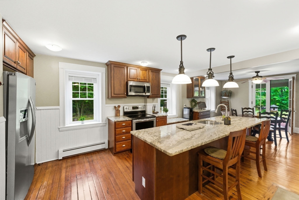 57 Upper Gore Road Webster, MA 01570 - Photo 11 of 42 a view of a dining room with furniture window and wooden floor