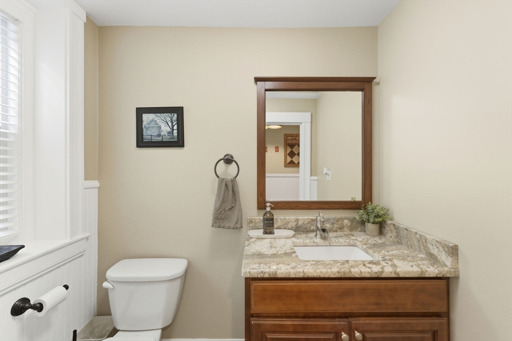 57 Upper Gore Road Webster, MA 01570 - Photo 12 of 42 a bathroom with a granite countertop sink and a mirror