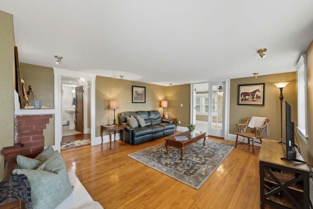 57 Upper Gore Road Webster, MA 01570 - Photo 18 of 42 a living room with furniture and wooden floor