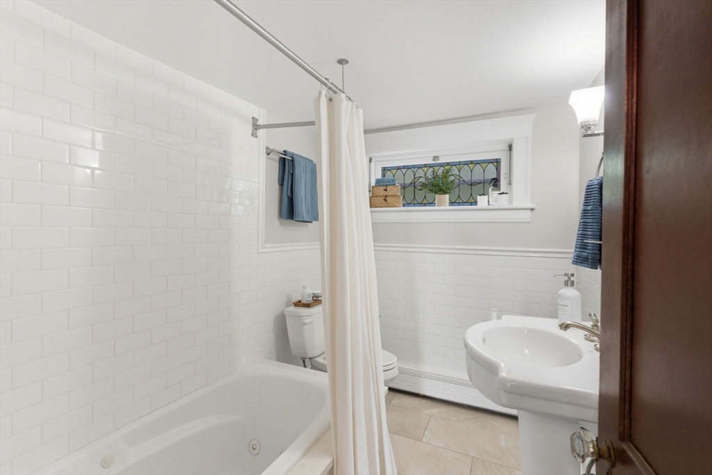 57 Upper Gore Road Webster, MA 01570 - Photo 21 of 42 a bathroom with a shower a toilet and a sink