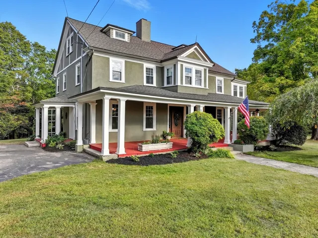 a front view of a house with a garden and porch