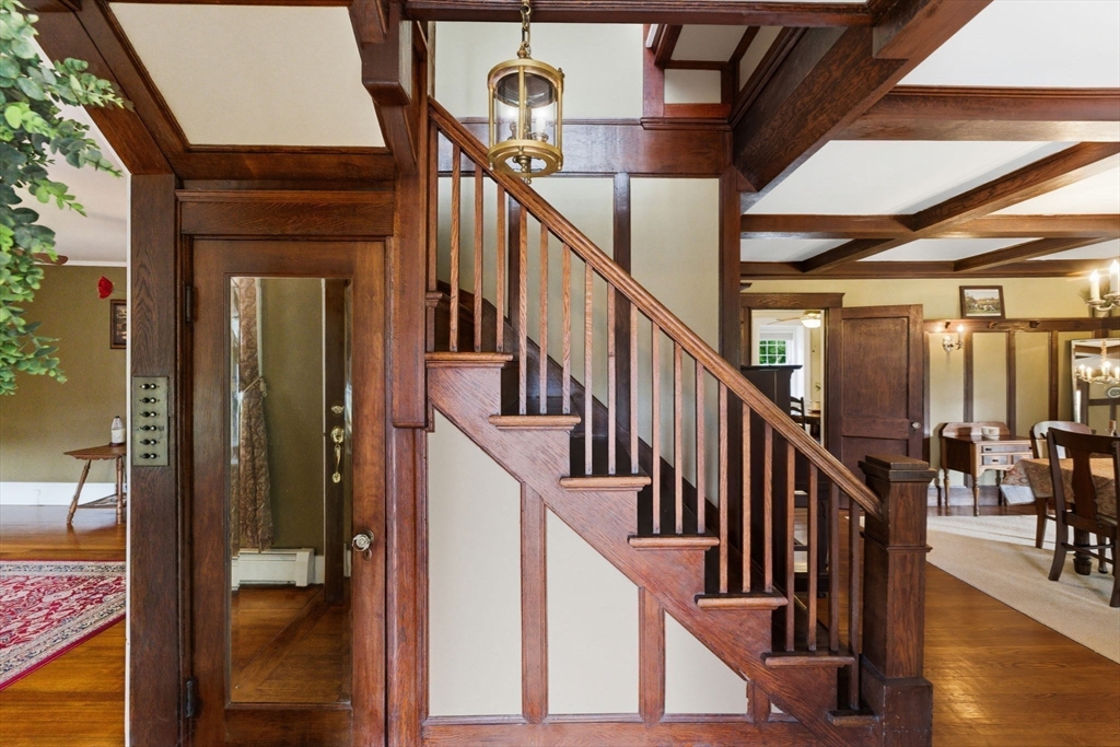 57 Upper Gore Road Webster, MA 01570 - Photo 3 of 42 a view of staircase with lots of frames on wall and windows