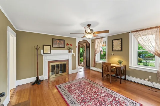 a living room with furniture and a fireplace