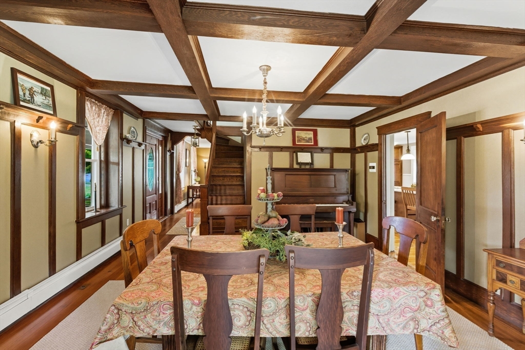 57 Upper Gore Road Webster, MA 01570 - Photo 6 of 42 a view of a dining room with furniture a chandelier and wooden floor