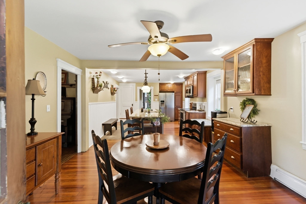 57 Upper Gore Road Webster, MA 01570 - Photo 7 of 42 a view of a dining room with furniture and wooden floor
