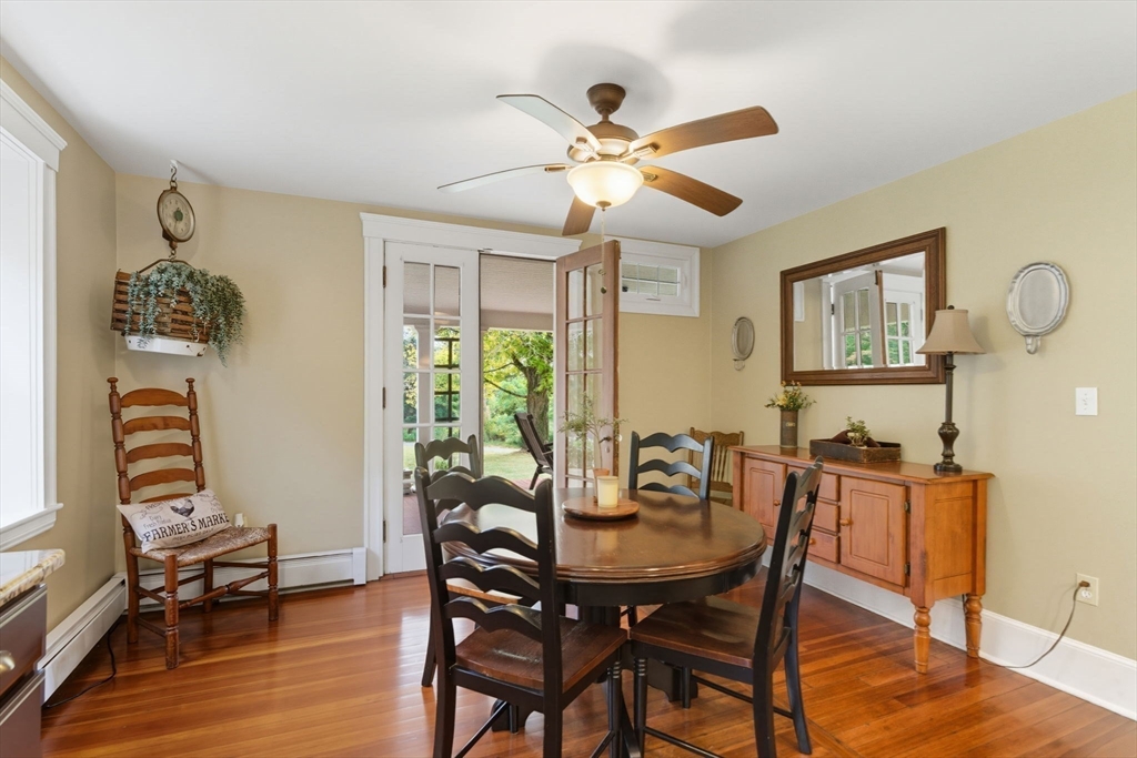 57 Upper Gore Road Webster, MA 01570 - Photo 9 of 42 a view of a dining room with furniture window and wooden floor