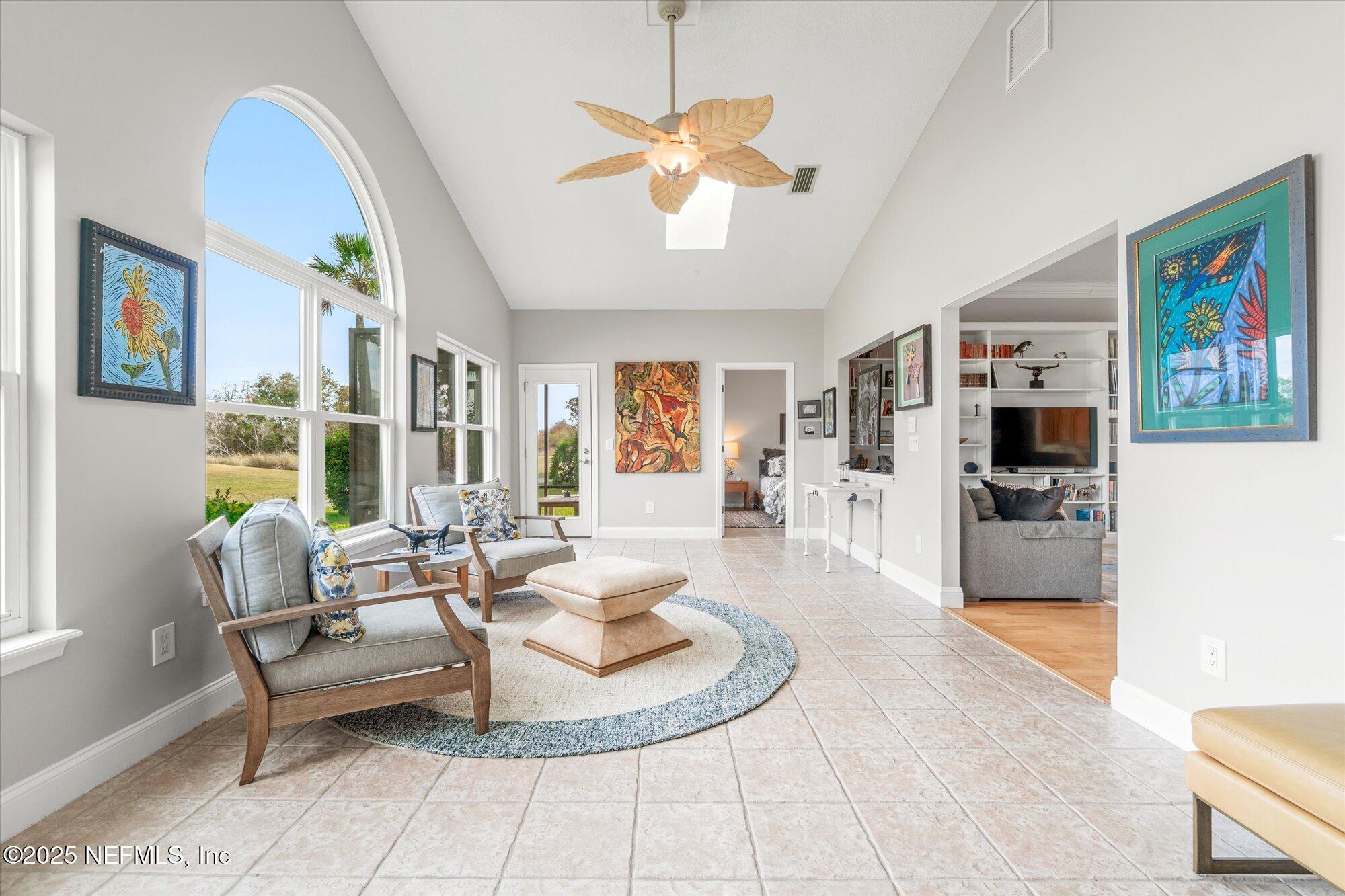606 Teeside Court St. Augustine, FL 32080 - Photo 19 of 47 a living room with furniture and a large window