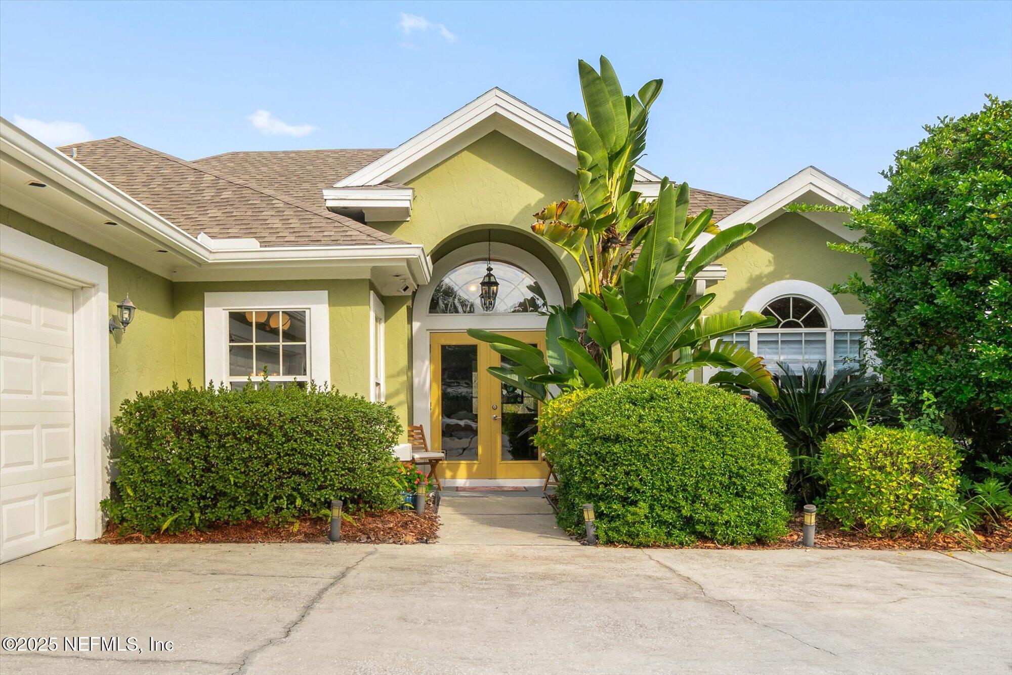 606 Teeside Court St. Augustine, FL 32080 - Photo 2 of 47 a front view of a house with garden
