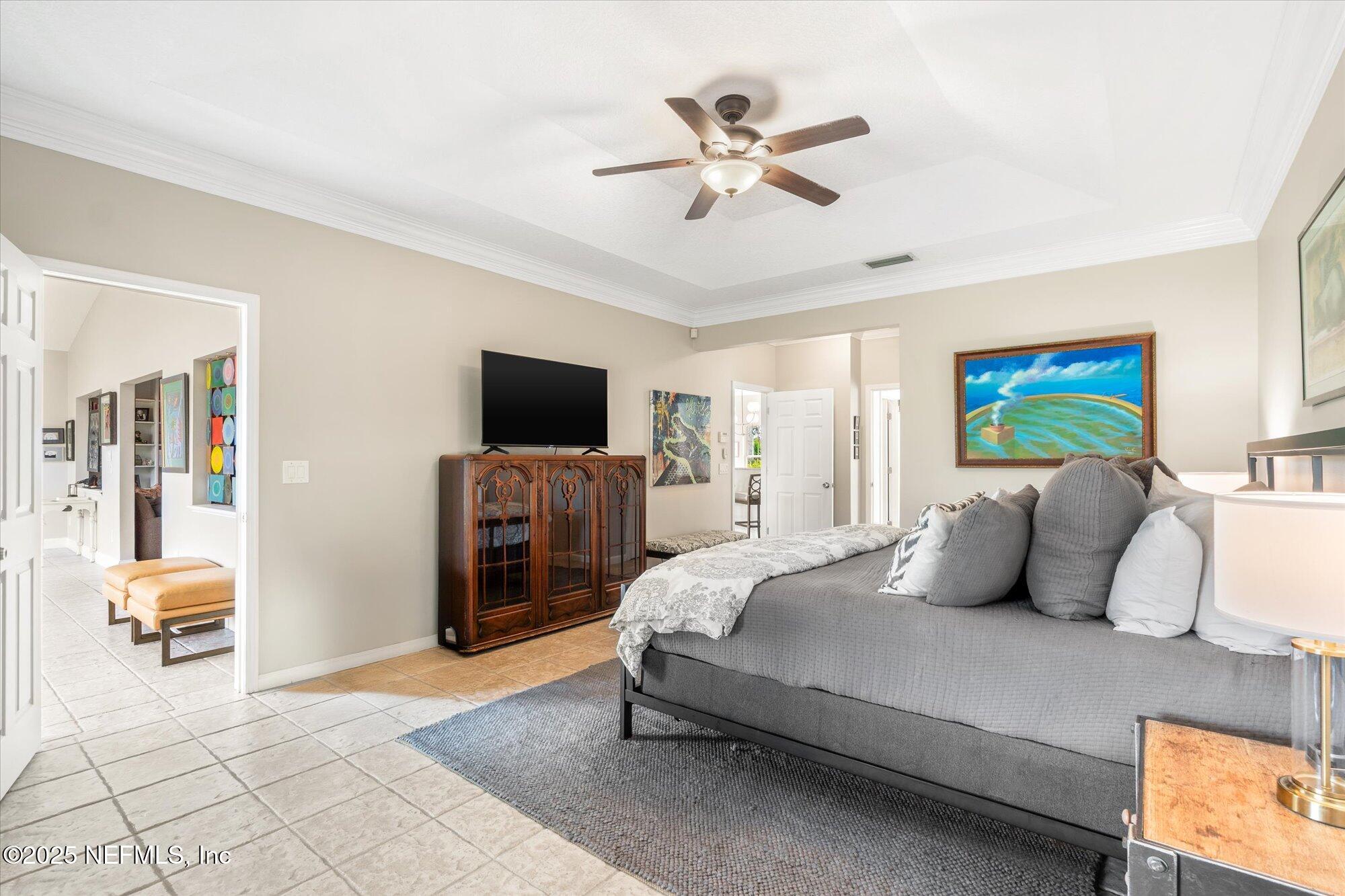 606 Teeside Court St. Augustine, FL 32080 - Photo 23 of 47 a bedroom with a bed and furniture