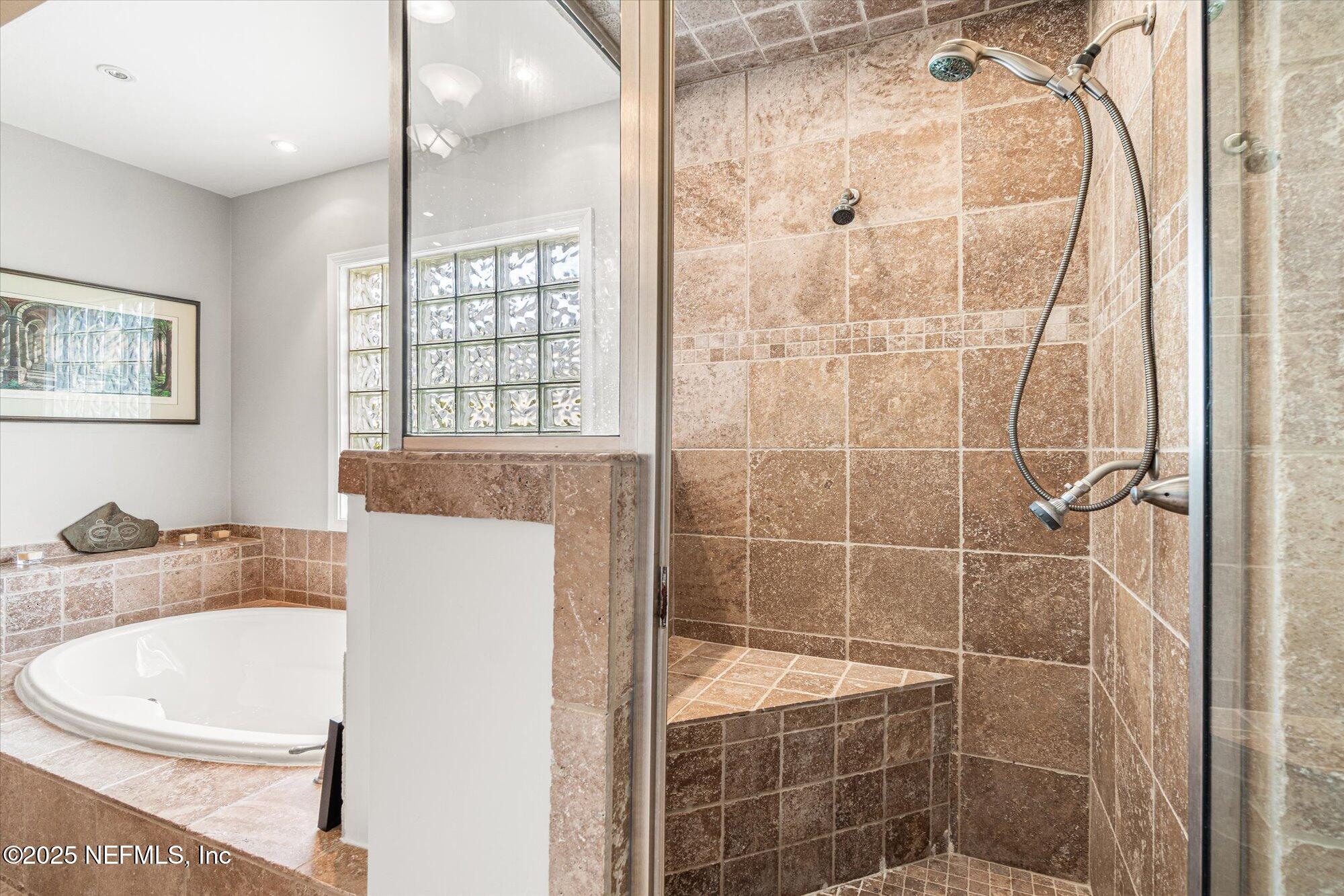 606 Teeside Court St. Augustine, FL 32080 - Photo 28 of 47 a bathroom with a bathtub and shower