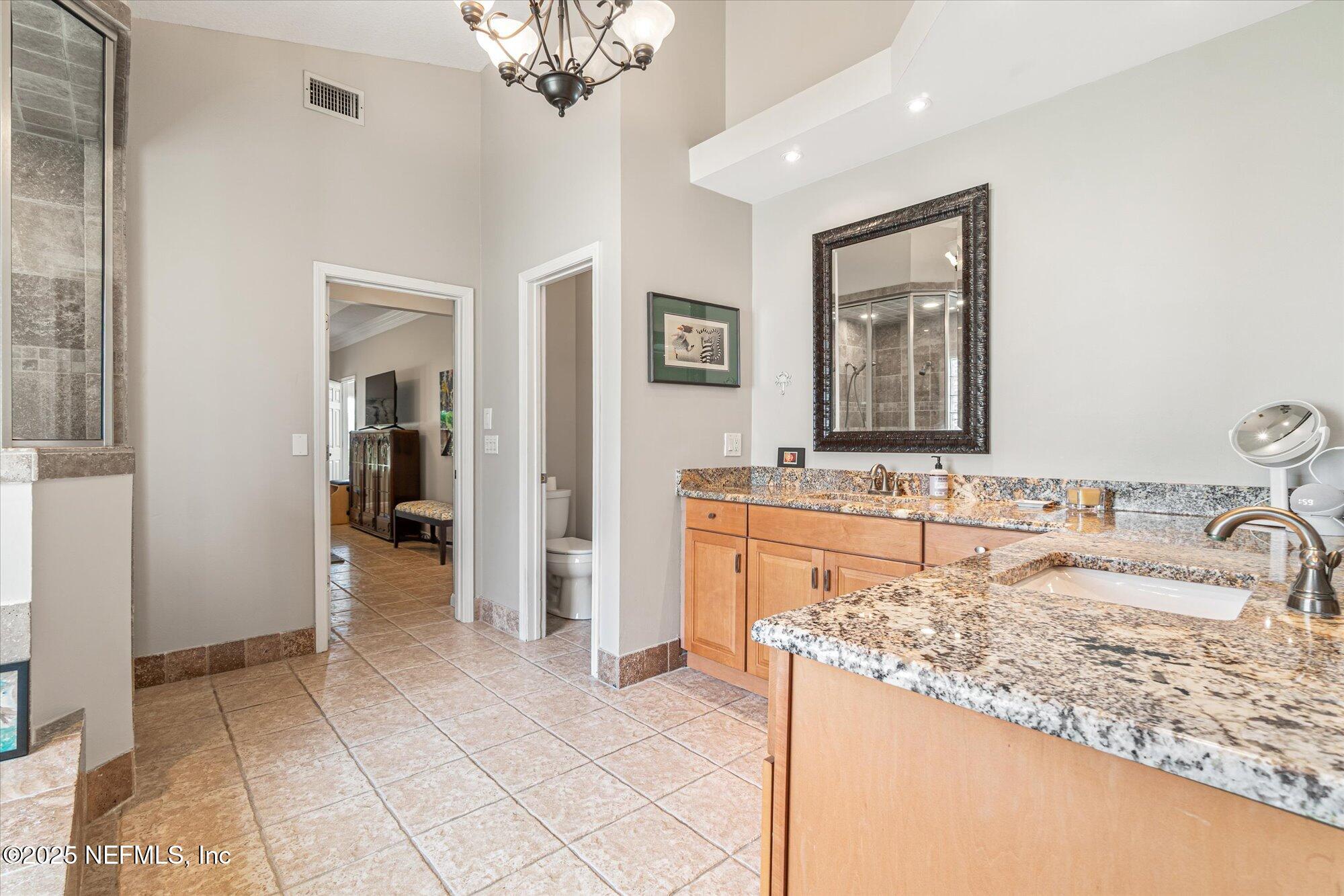 606 Teeside Court St. Augustine, FL 32080 - Photo 29 of 47 a bathroom with a sink and a mirror