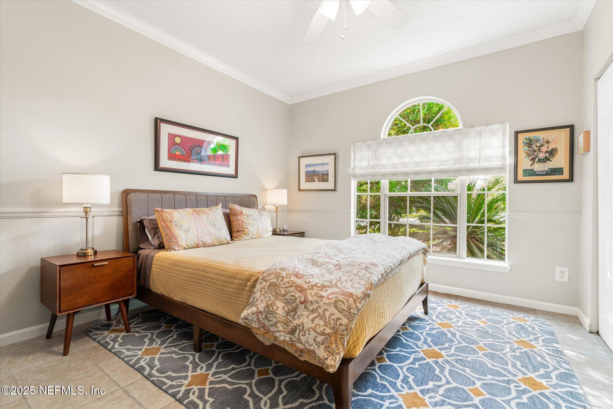 606 Teeside Court St. Augustine, FL 32080 - Photo 33 of 47 a bedroom with a bed and a window