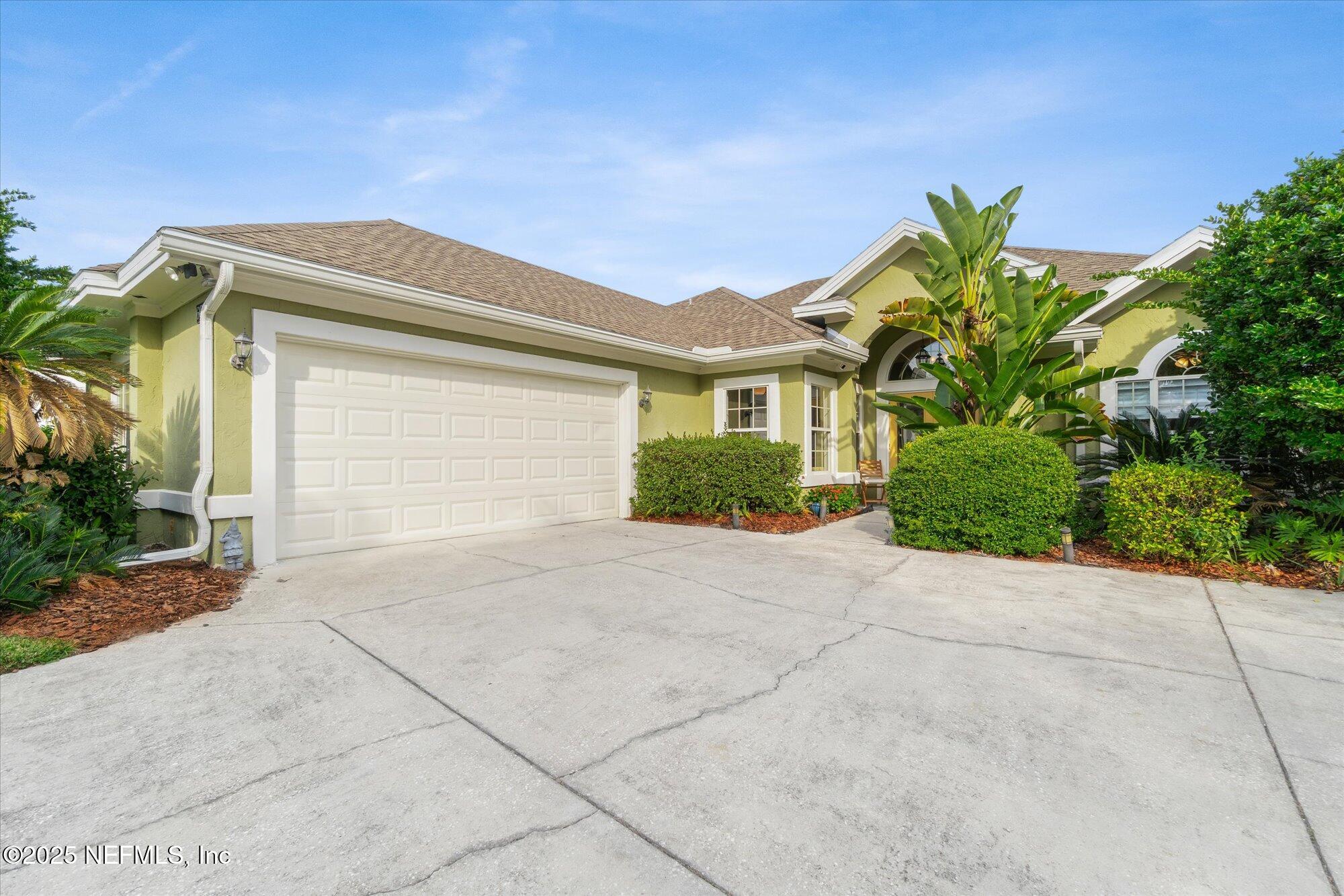 606 Teeside Court St. Augustine, FL 32080 - Photo 38 of 47 a front view of a house with a yard and a garage