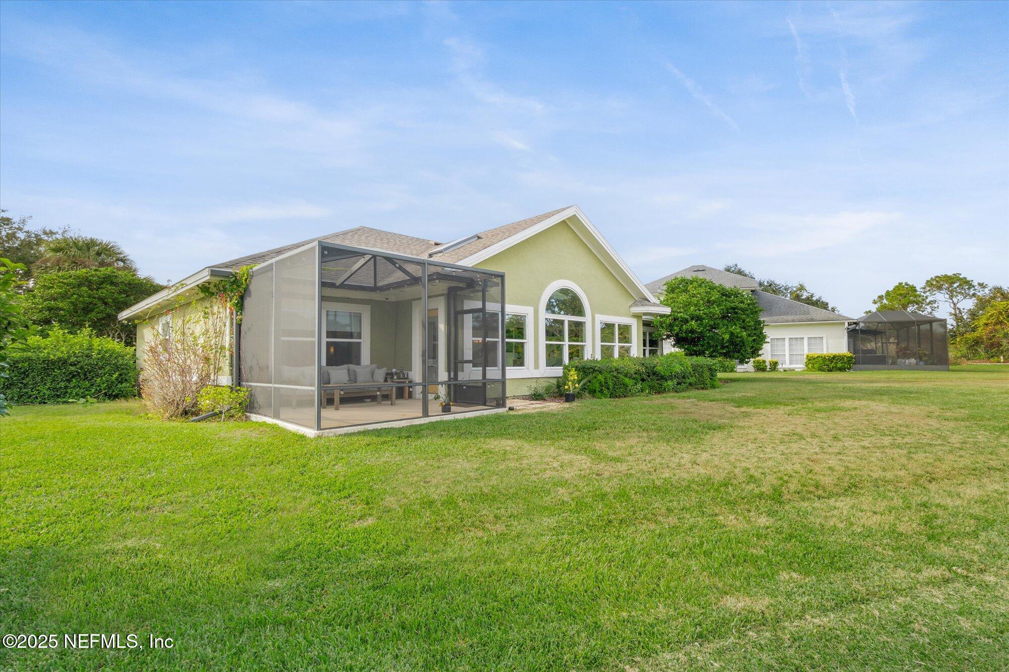 606 Teeside Court St. Augustine, FL 32080 - Photo 40 of 47 a view of a house with a big yard and garden