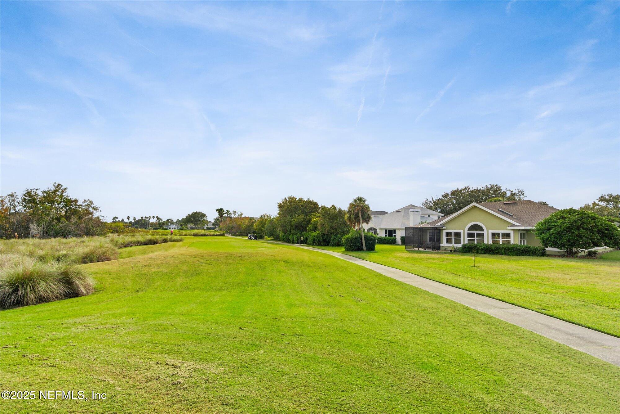 606 Teeside Court St. Augustine, FL 32080 - Photo 41 of 47 a view of a lake with a big yard