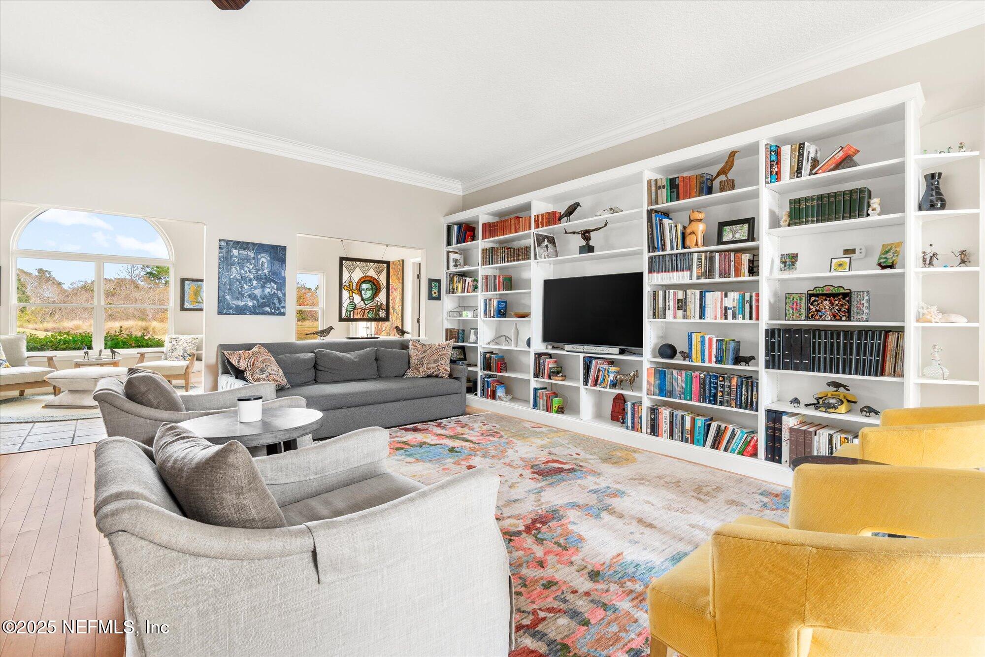 606 Teeside Court St. Augustine, FL 32080 - Photo 7 of 47 a living room with furniture and a flat screen tv