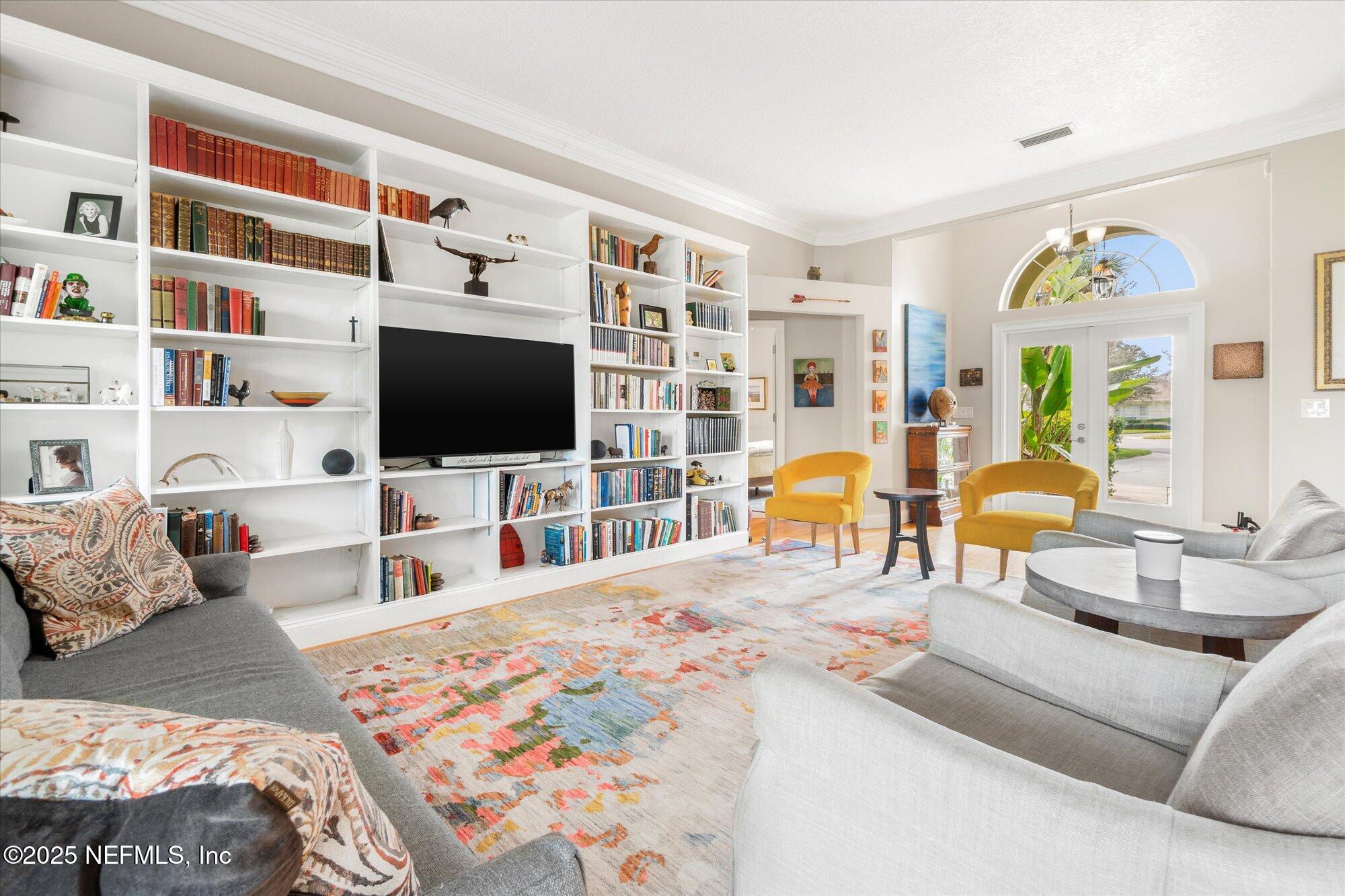 606 Teeside Court St. Augustine, FL 32080 - Photo 8 of 47 a living room with furniture and a flat screen tv