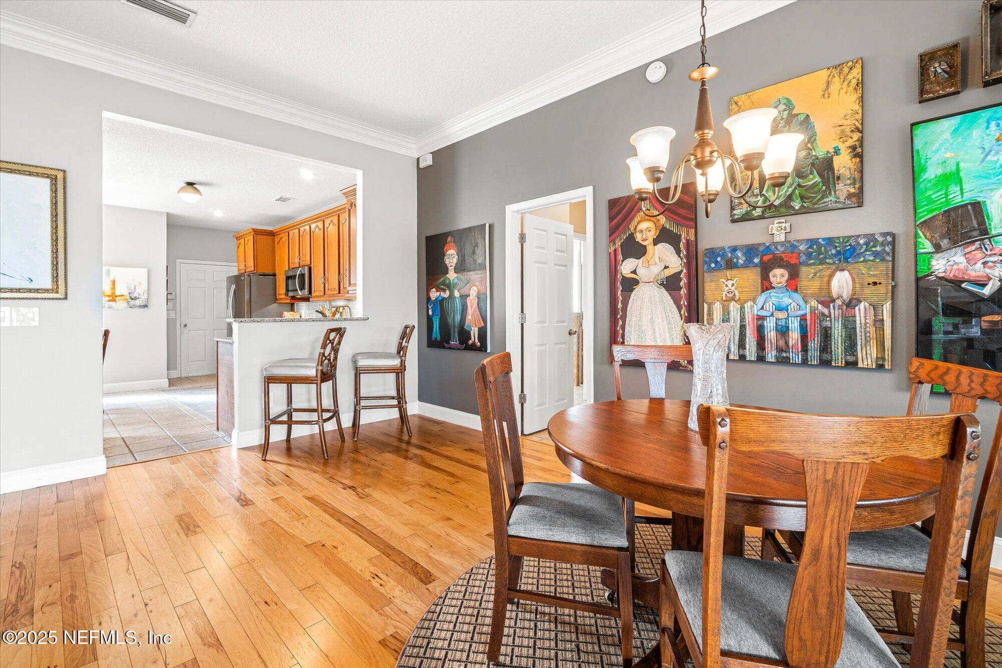 606 Teeside Court St. Augustine, FL 32080 - Photo 10 of 47 a view of a dining room with furniture and a floor to ceiling window