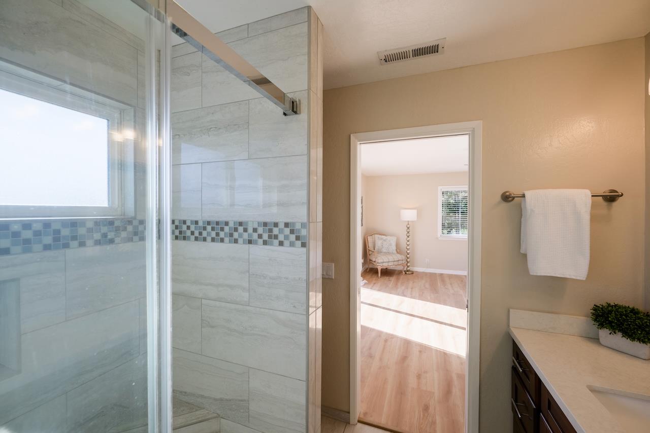 155 Rabbits Run Road Santa Cruz, CA 95060 - Photo 62 of 113 a bathroom with a sink and mirror with shower