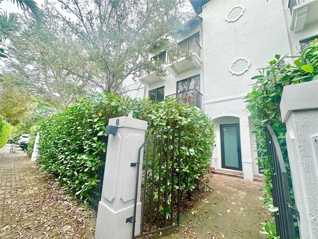 front view of a house with a garden