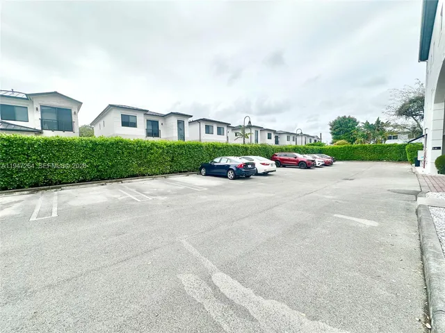 front view of a house with a garden
