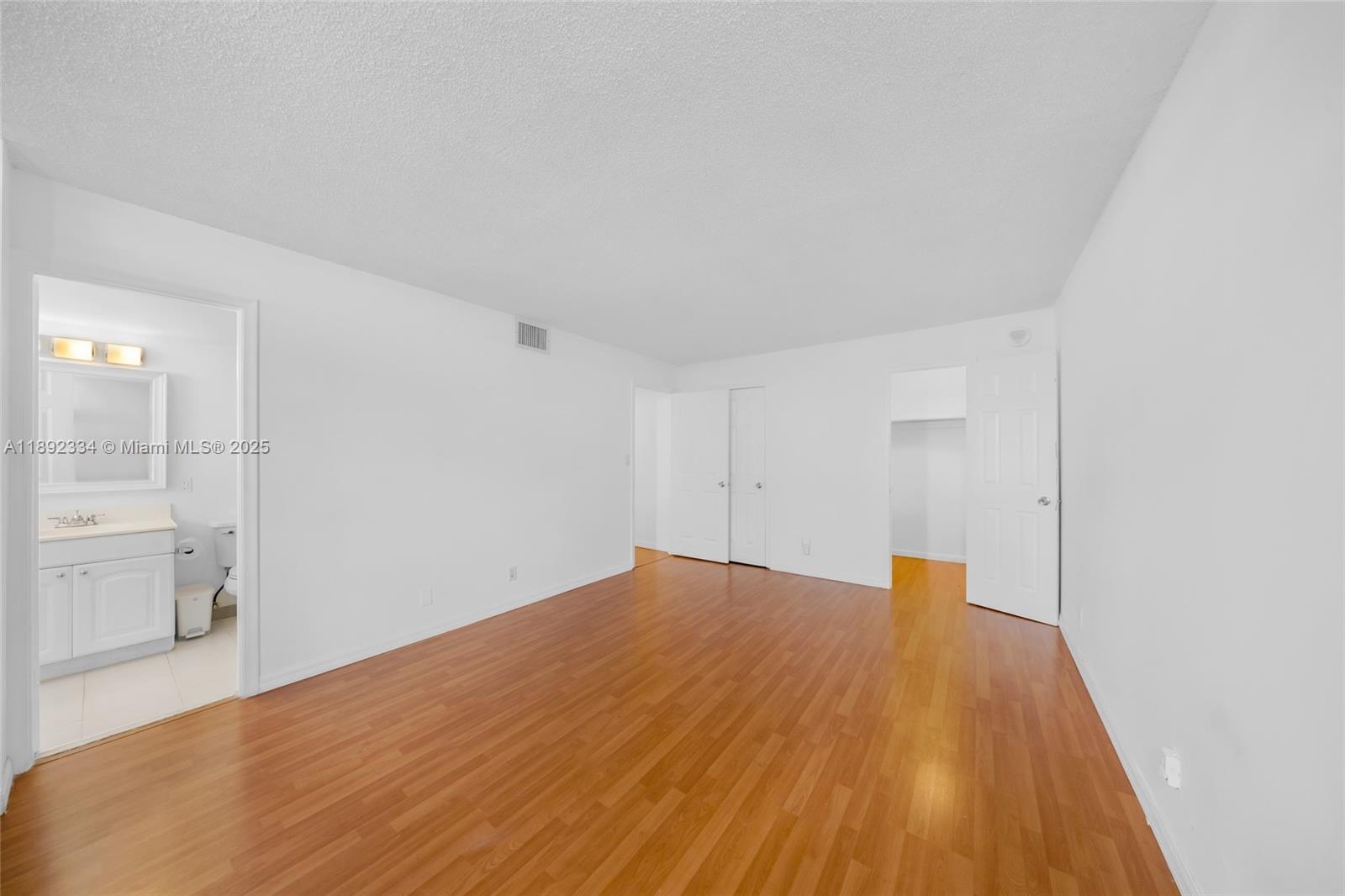 137 Golden Isles Drive, Unit 508 Hallandale Beach, FL 33009 - Photo 12 of 24 a big room with wooden floor and a sink
