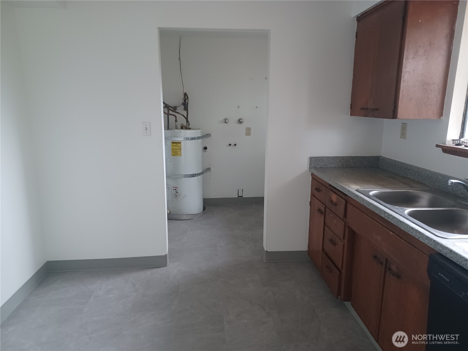 714 Union Avenue Steilacoom, WA 98388 - Photo 7 of 16 a view of a kitchen with a sink and a stove