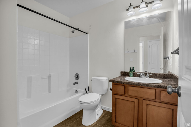 1836 West 800 North Mapleton, UT 84663 - Photo 12 of 38 Full bath featuring vanity, dark tile patterned floors, and bathtub / shower combination
