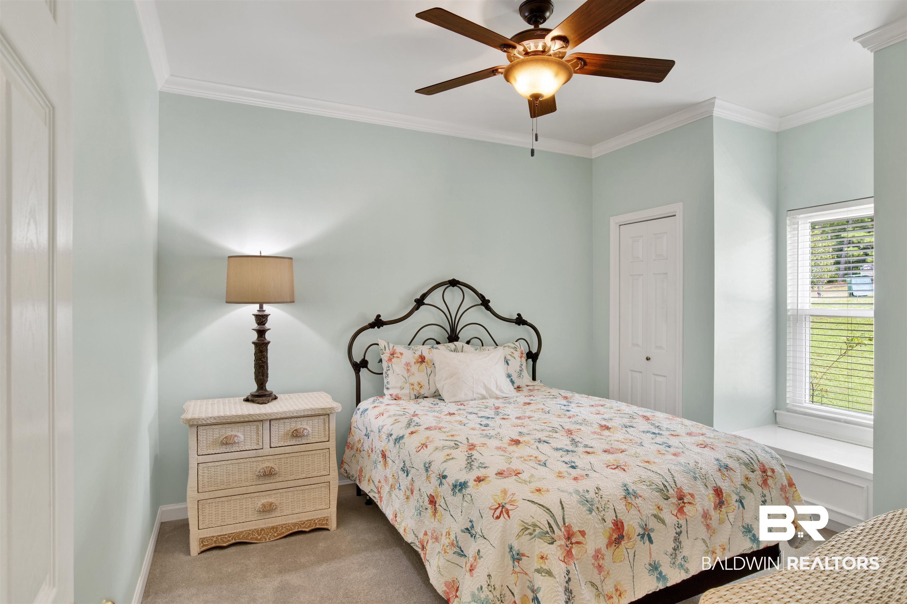 638 Southern Way Daphne, AL 36527 - Photo 17 of 26 Bedroom featuring ornamental molding, multiple windows, carpet, and ceiling fan