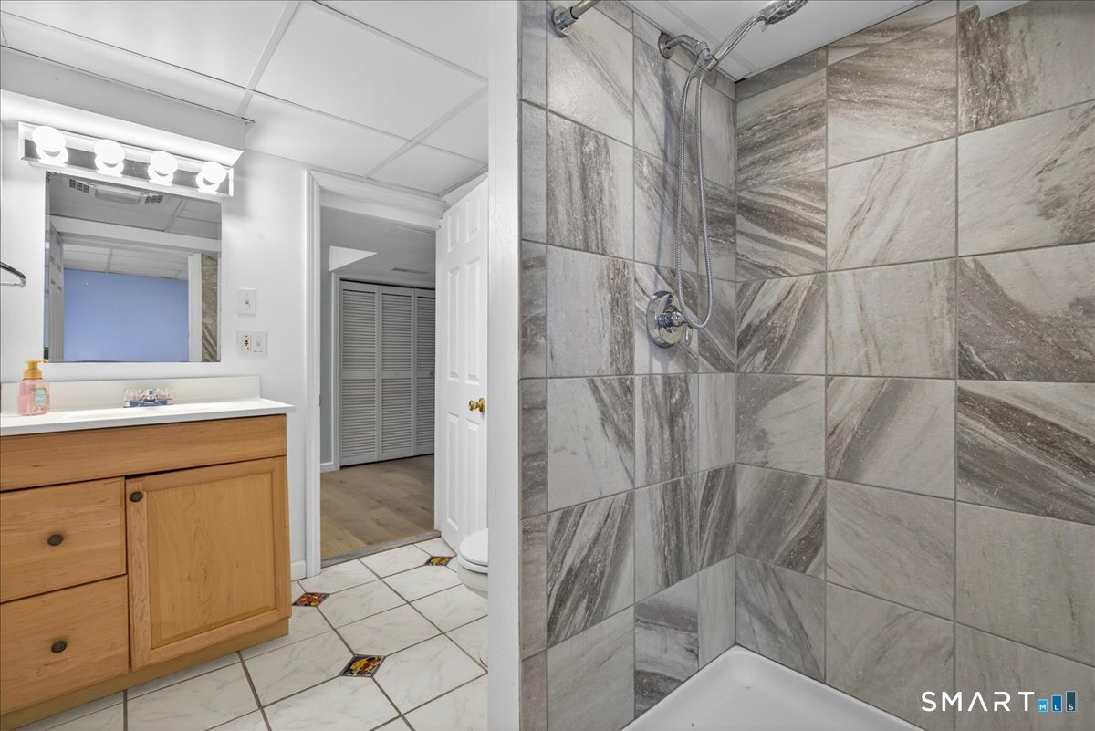 1006 King Road Cheshire, CT 06410 - Photo 26 of 40 The lower level includes a full bath with shower and laundry, including newer Speed Queen washer and dryer.