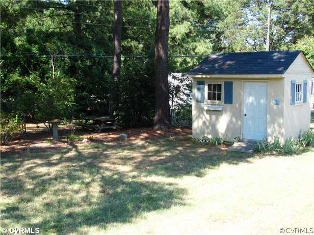 8218 Brookfield Road Richmond, VA 23227 - Photo 12 of 12 Yard/Garden - Nice level yard with a mix of sun an