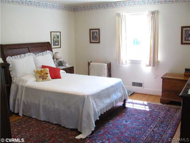 8218 Brookfield Road Richmond, VA 23227 - Photo 10 of 12 Master Bedroom - The Master Bedroom has hardwood f