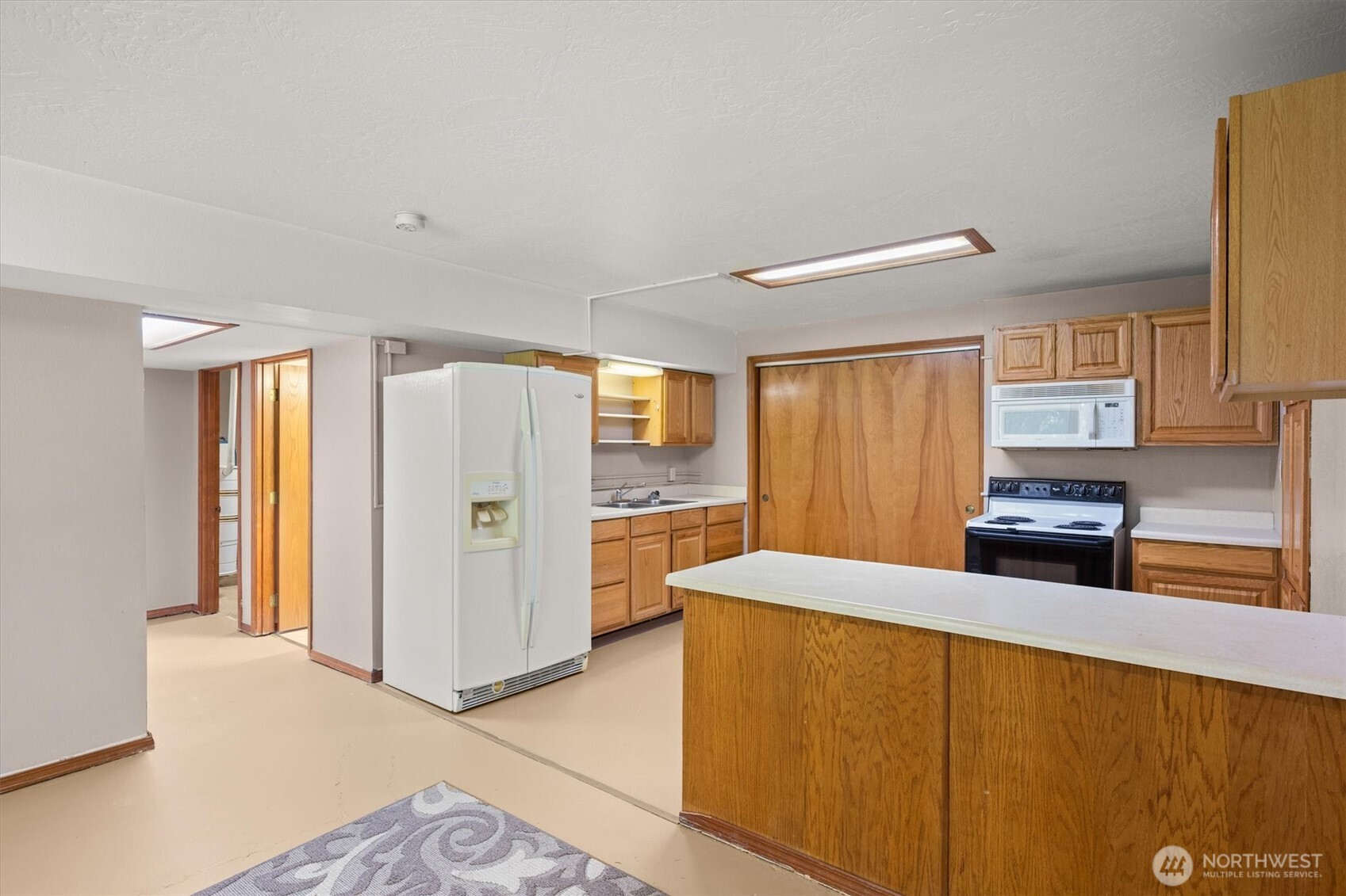 672 Walker Road Kelso, WA 98626 - Photo 19 of 40 a kitchen with stainless steel appliances a refrigerator and a stove top oven