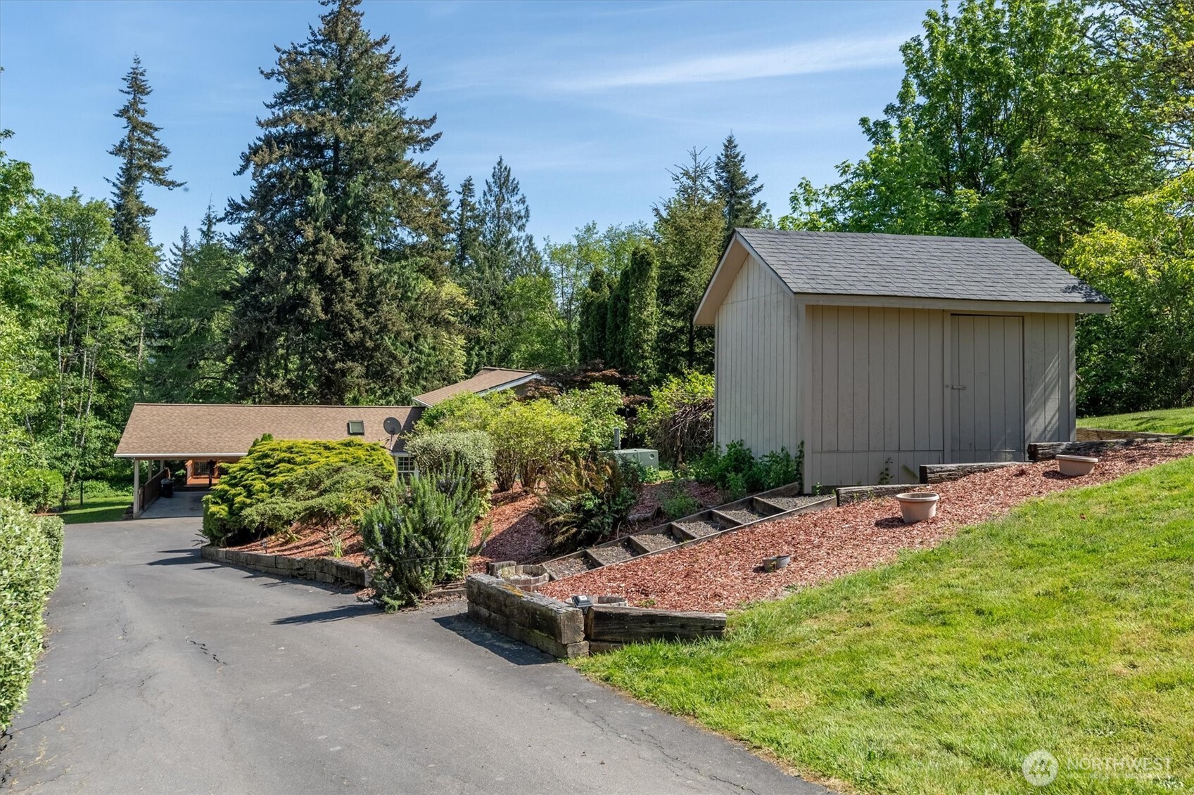 672 Walker Road Kelso, WA 98626 - Photo 33 of 40 a view of a backyard with plants and a garden