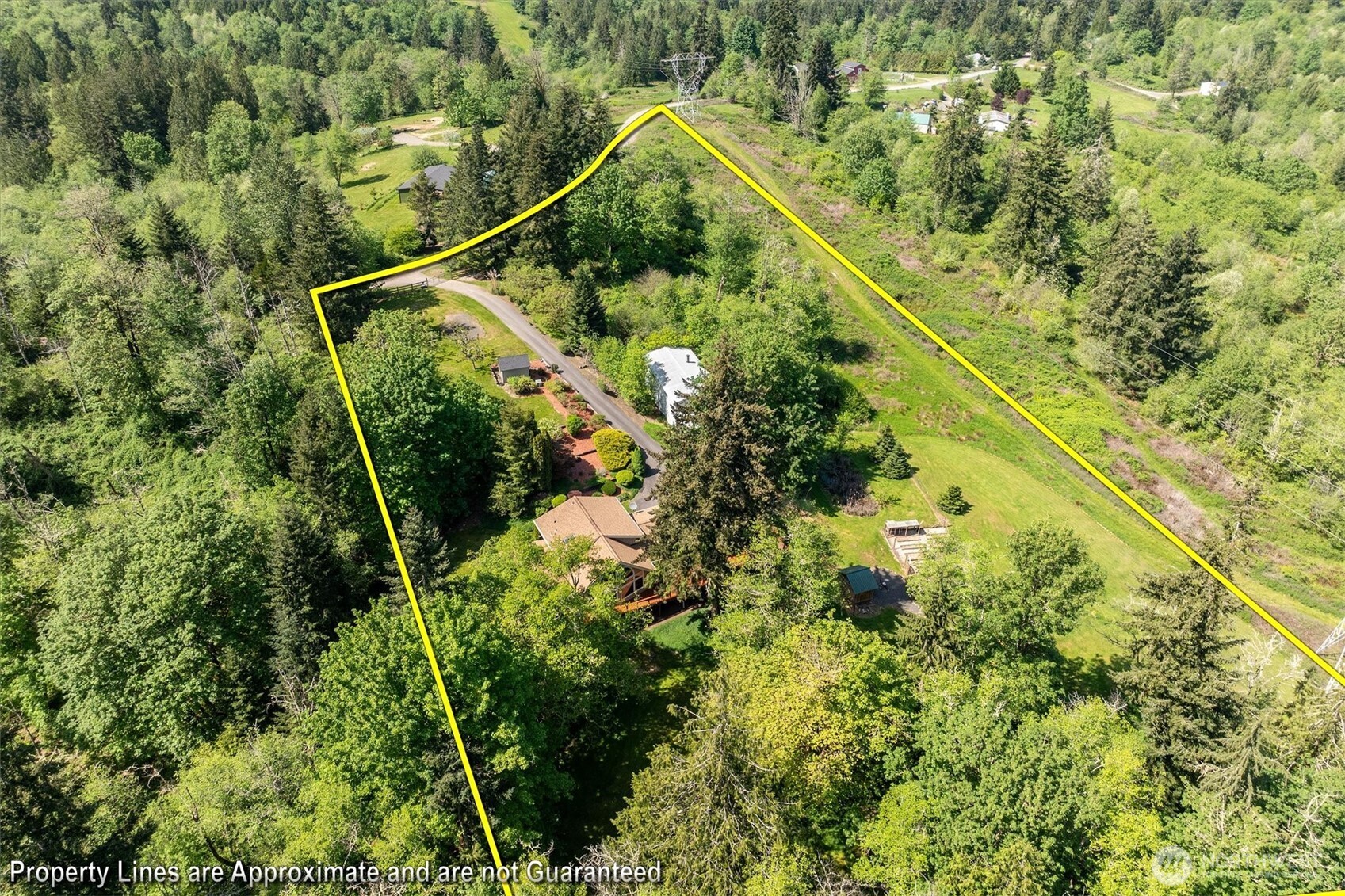 672 Walker Road Kelso, WA 98626 - Photo 39 of 40 a view of a house with a lush green forest