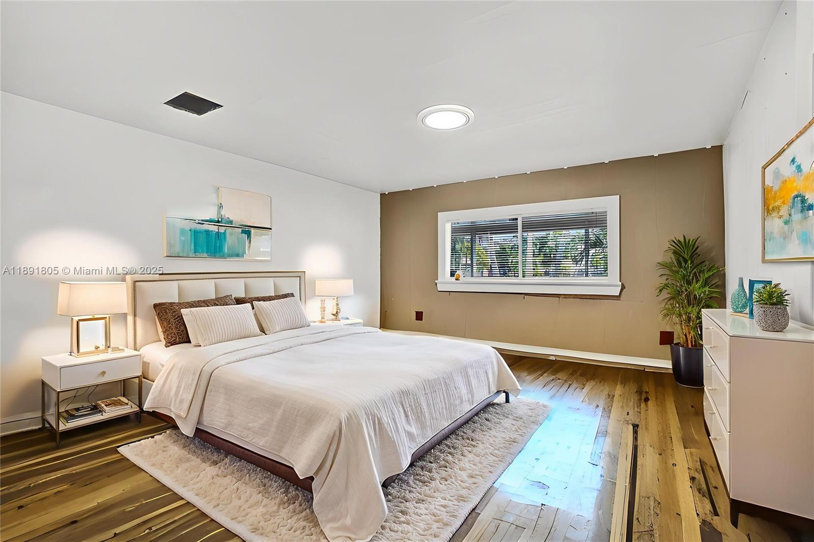 11201 Southwest 55th Street Miramar, FL 33025 - Photo 11 of 38 a spacious bedroom with a bed and a desk