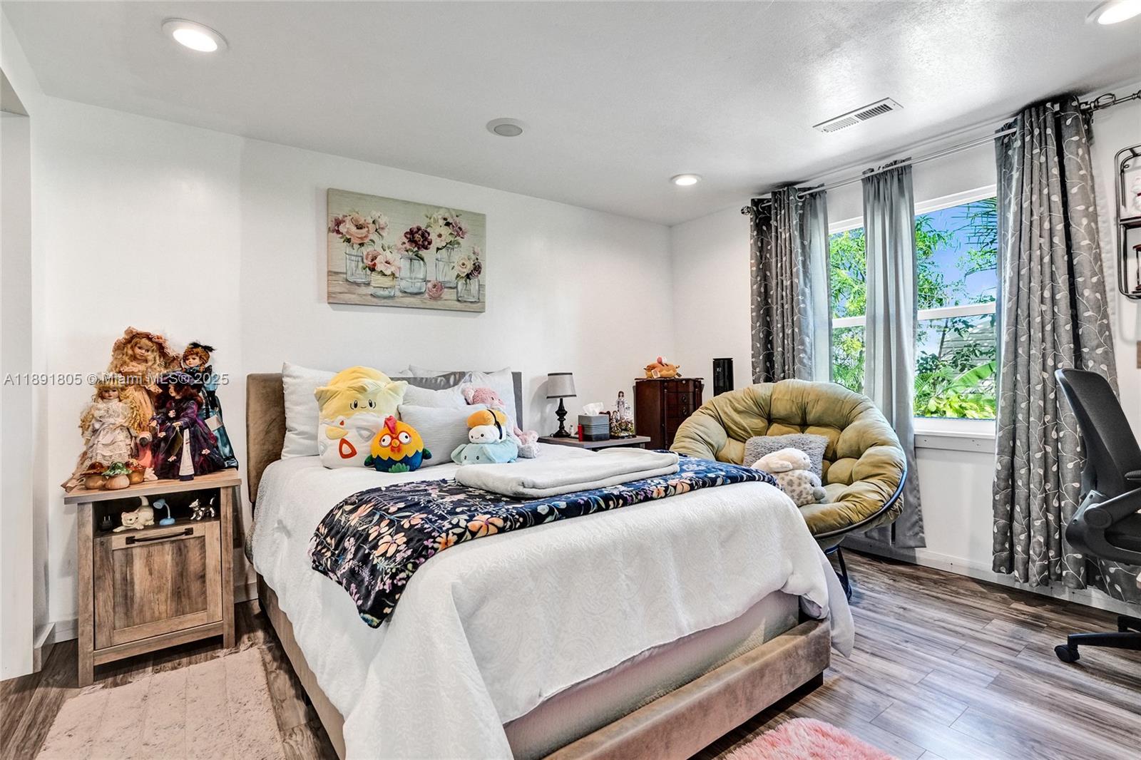 11201 Southwest 55th Street Miramar, FL 33025 - Photo 12 of 38 a bedroom with bed and a large window