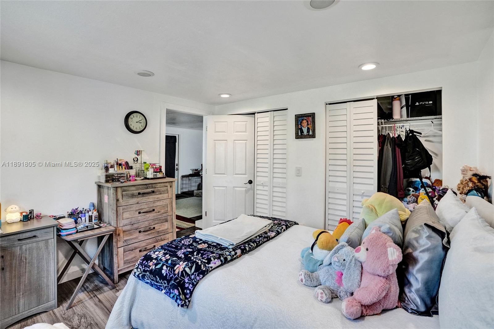 11201 Southwest 55th Street Miramar, FL 33025 - Photo 14 of 38 a bedroom with a bed and a window