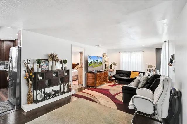 a living room with furniture a lamp and a fireplace