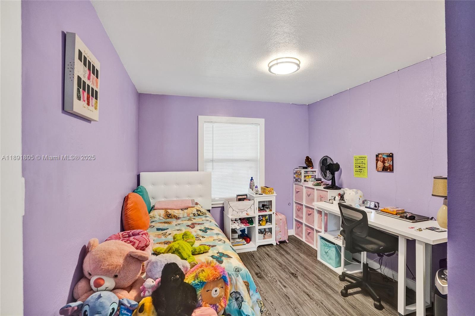 11201 Southwest 55th Street Miramar, FL 33025 - Photo 22 of 38 a bed room with a bed and a baby crib