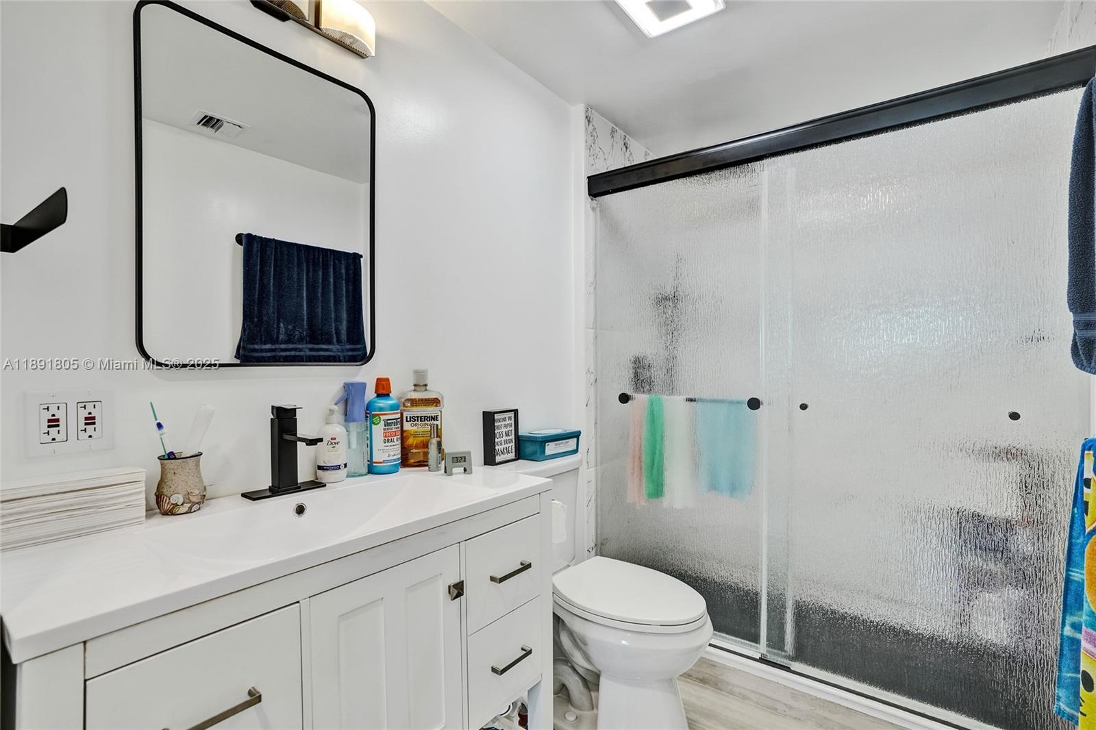 11201 Southwest 55th Street Miramar, FL 33025 - Photo 25 of 38 a bathroom with a sink toilet and shower