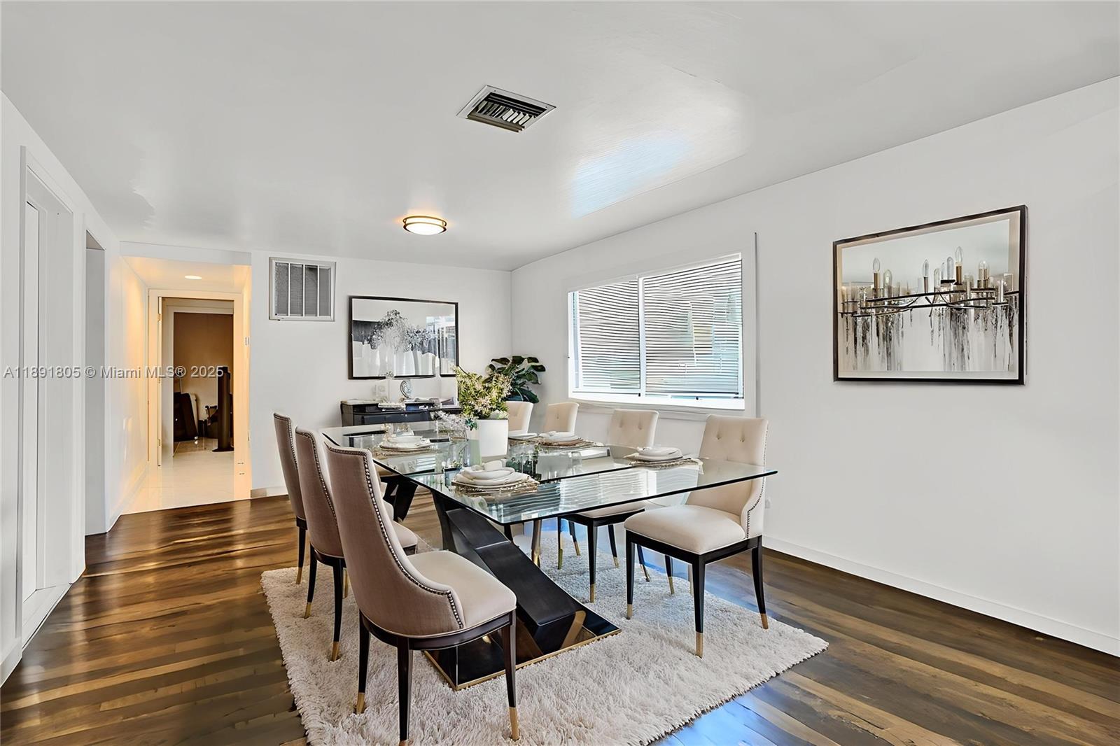 11201 Southwest 55th Street Miramar, FL 33025 - Photo 8 of 38 a view of a dining room with furniture window and wooden floor
