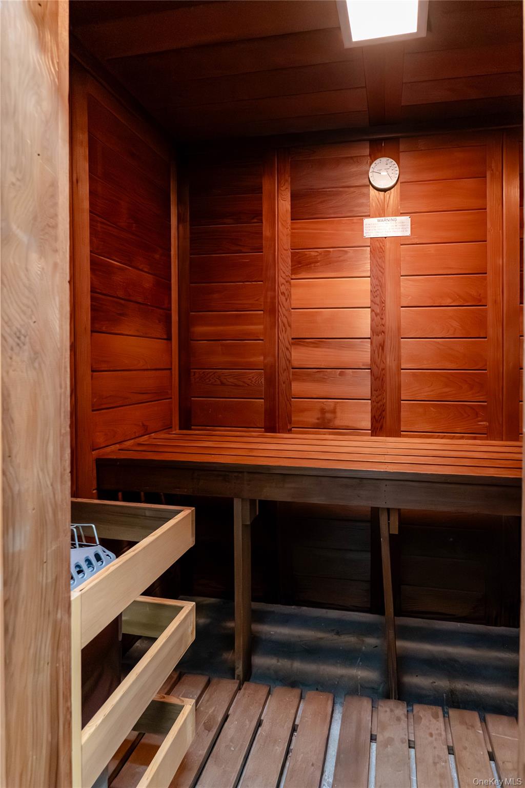 188 East 70th Street, Unit 8B Manhattan, NY 10021 - Photo 10 of 12 a room with storage and window