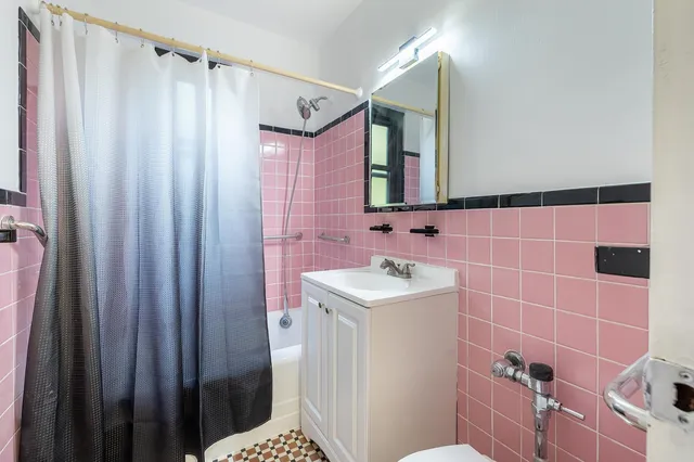 a bedroom with bed and a window